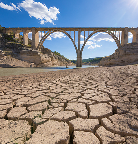 landscape of dry earth ground and viaduct, extreme drought in Entrepenas reservoir, in Guadalajara, Castilla, Spain Europe