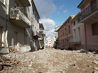 Debris and mud deposited in the streets after flood